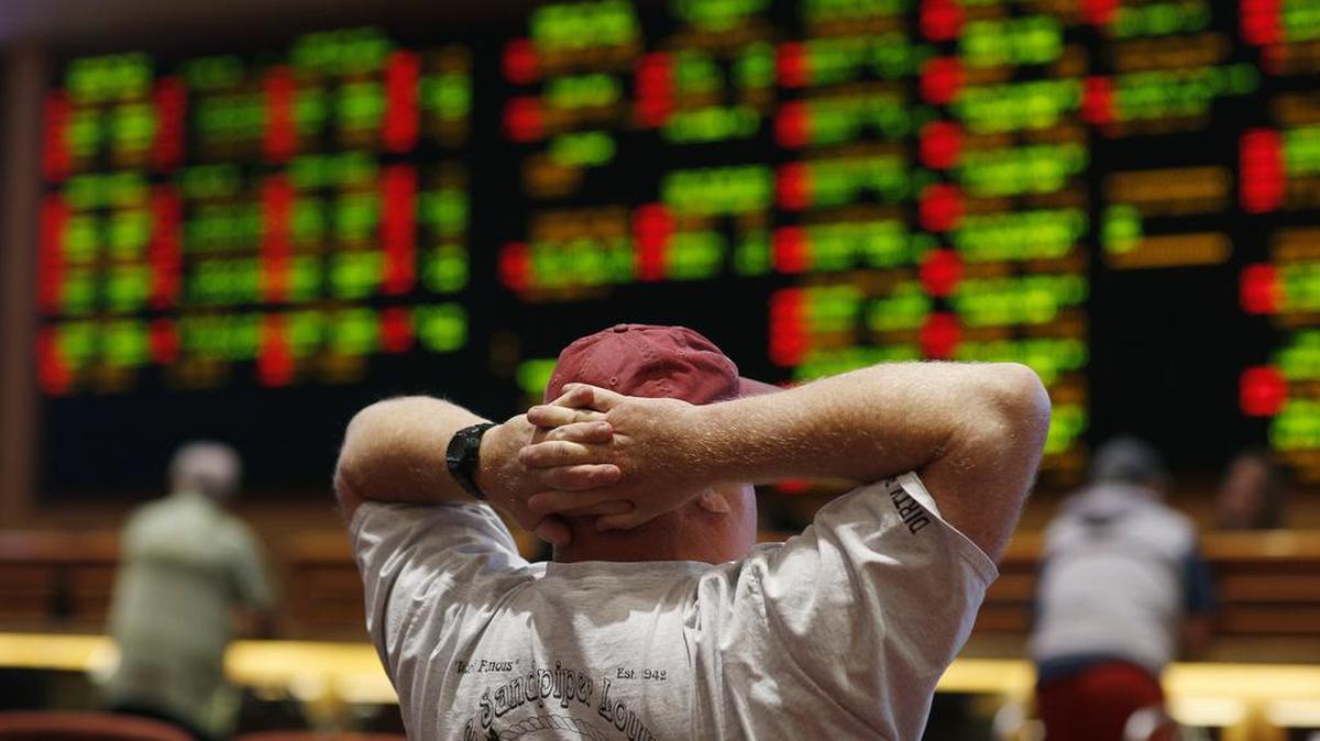 A man watches a baseball game in the sports book at the South Point hotel-casino in 2018 in Las Vegas. The Supreme Court now allows states to allow gambling on sports across the nation, striking down a federal law that barred betting on football, basketball, baseball and other sports in most states.