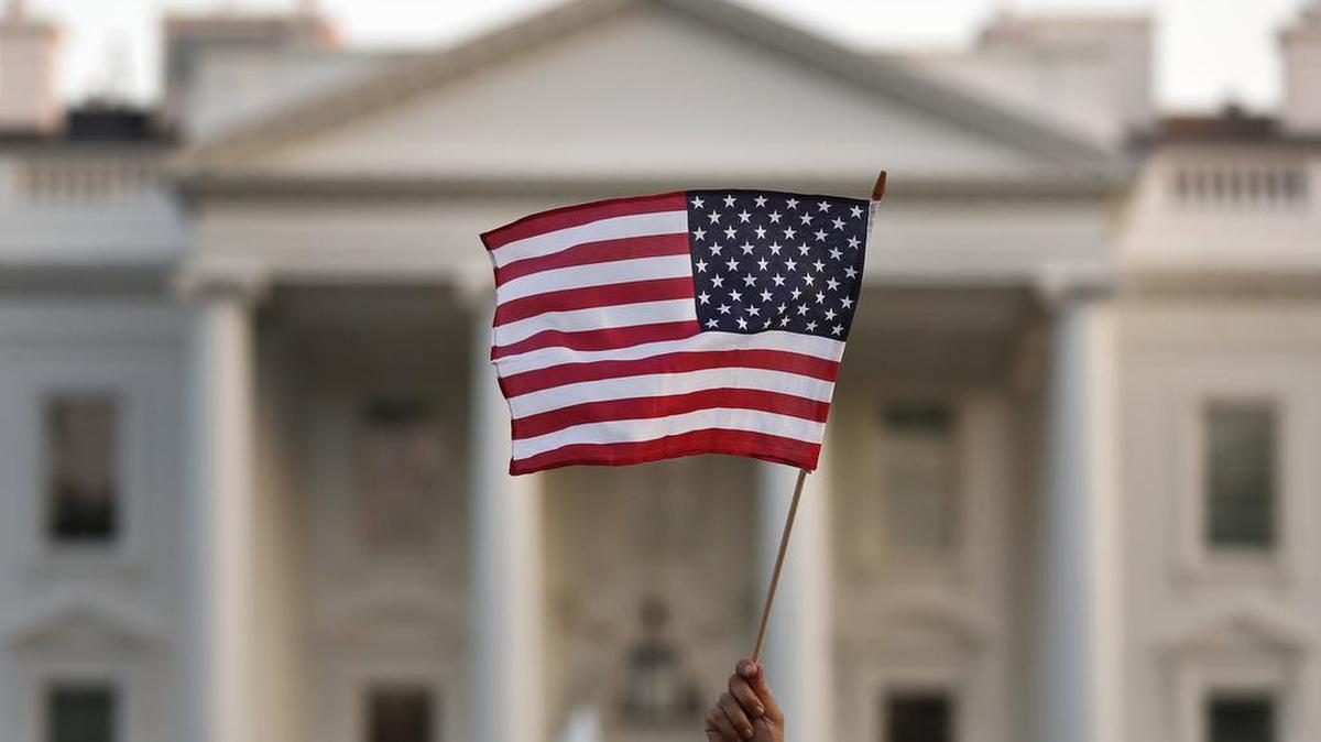 In this 2017 file photo, a flag is waved outside the White House, in Washington.
