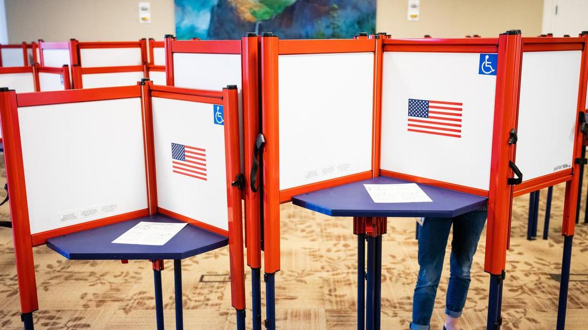 A voter fills out her ballot in an early vote center in Merced, Calif., March 2, 2020.