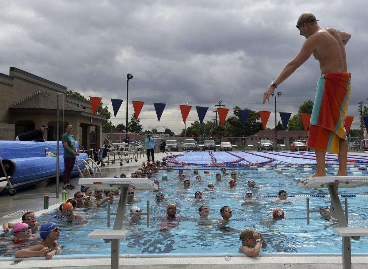 Olympic gold medalists Amanda Beard and Dave Walters lead a clinic for the Tri-City Channel Cats Saturday at Memorial Pool in Pasco.
