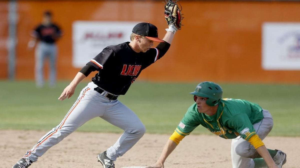 Kennewick second baseman TJ Rea, left, tries to make a play on Richland’s Taiton Gillespie during Friday’s Mid-Columbia Conference doubleheader at Roy Johnson Field in Kennewick. The Bombers won the first game 8-5.