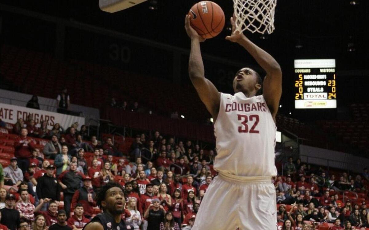 
Washington State guard Que Johnson (32) drives to the basket past Stanford guard Chasson Randle (5) during the second half Jan. 31 in Pullman. Washington State won 89-88.
