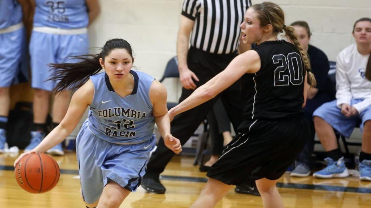 Columbia Basin College’s Marissa Caballero, left, drives during a game against Wenatchee Valley College earlier this season. Caballero is averaging 14.3 points a game for the Hawks, who will advance to the NWAC tournament.