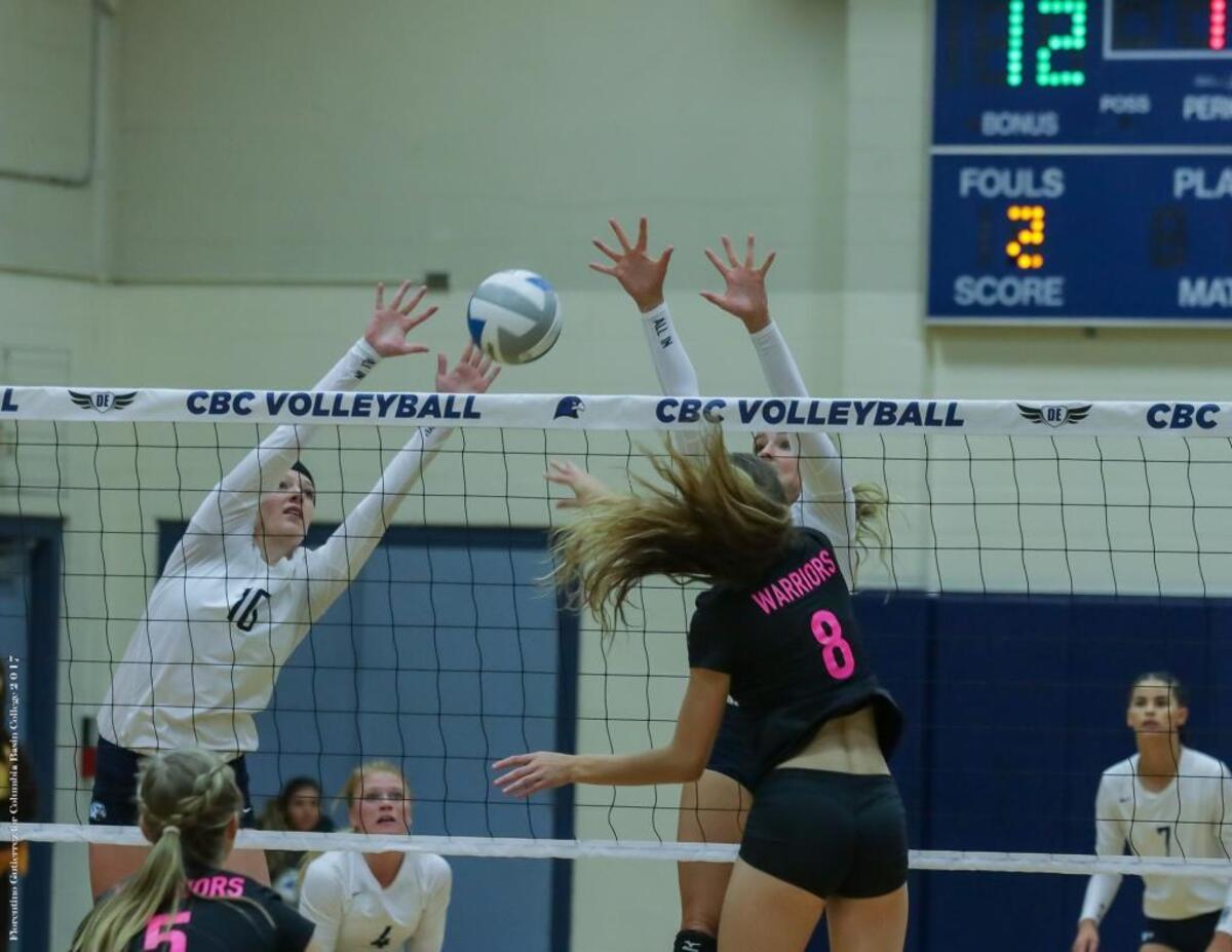 Columbia Basin College’s Esther Schuh (left) helps out with a block against Walla Walla’s Emmah Peterson (8) during their Oct. 13 match in Pasco.