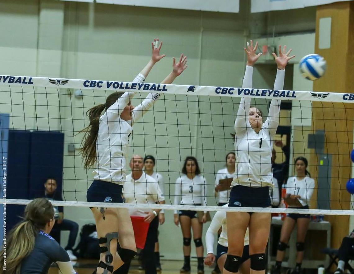 Columbia Basin College’s Kyrsten Whitmore (left) and Ally Bott go up for a block against Blue Mountain during their Nov. 8 match in Pasco.