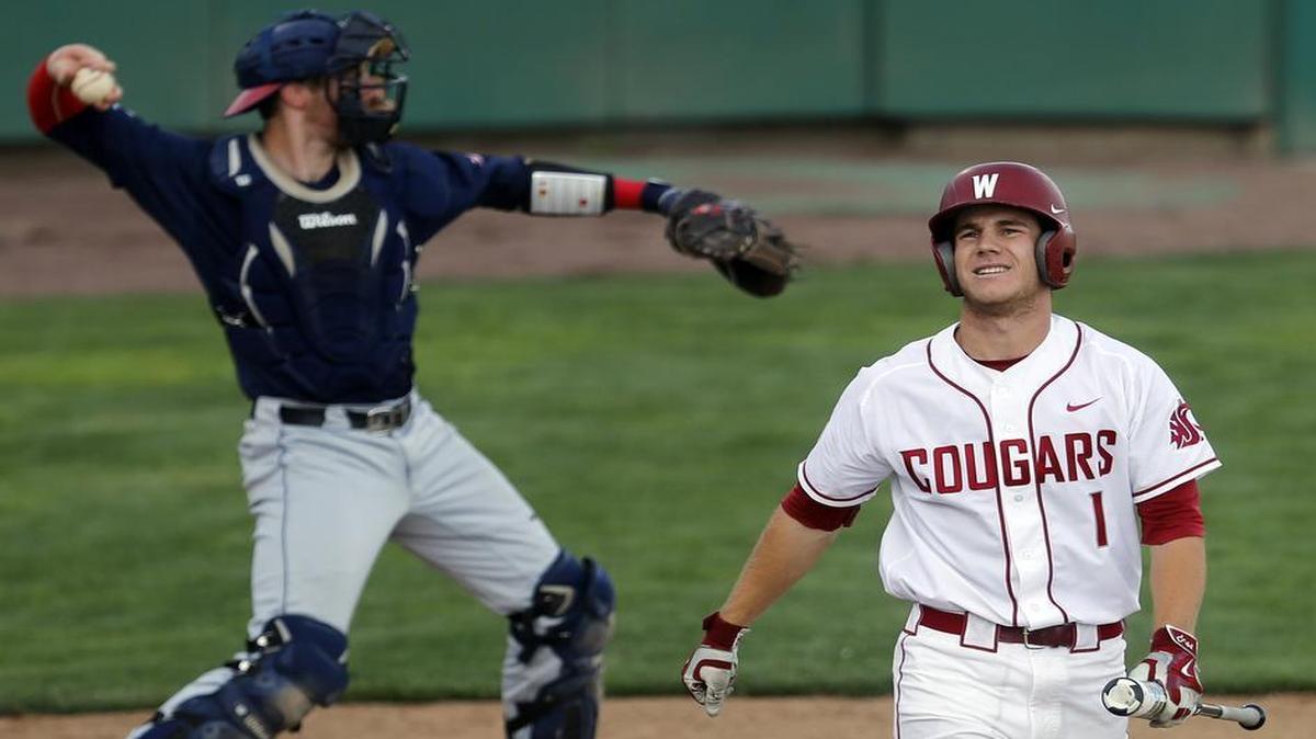 Washington State leadoff hitter Derek Chapman heads back to the dugout after striking out as Gonzaga catcher Joey Harris starts the ball around the horn in the first inning of Tuesday’s Cougar Diamond Classic baseball game at Gesa Stadium in Pasco.