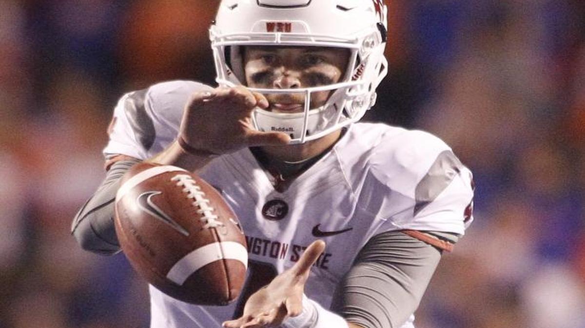 Washington State quarterback Luke Falk, taking a snap during a 2016 road game against Boise State, was named to three national college football awards preseason watch lists this week.