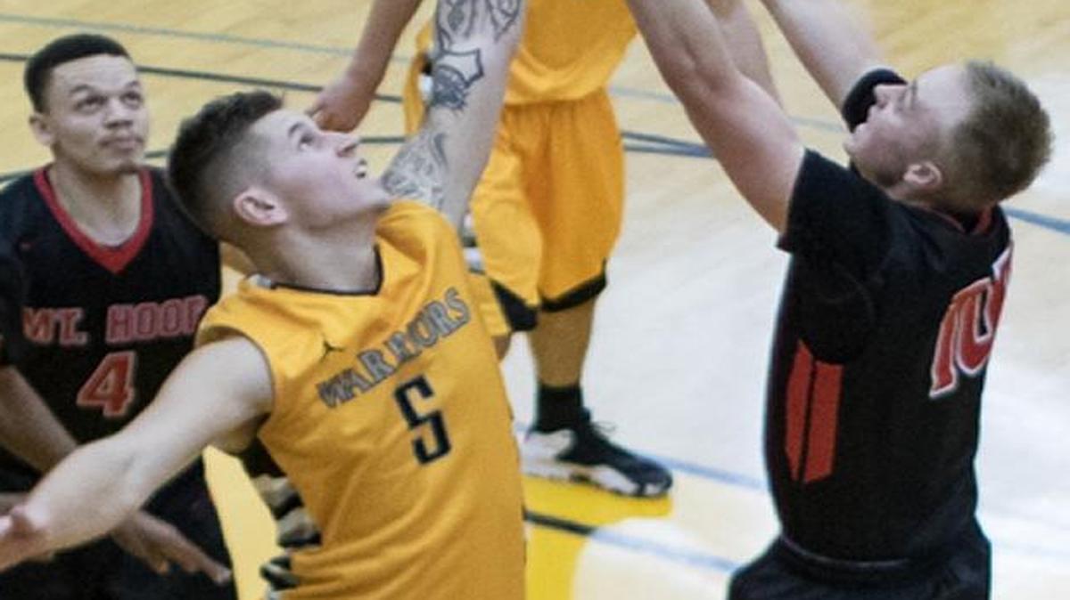 Walla Walla’s Gabe Porter (5) battles for a rebound against Mt. Hood earlier this season. Porter leads the Warriors in scoring with 22.3 points per game going into the NWAC Final Four on Saturday against Lower Columbia.