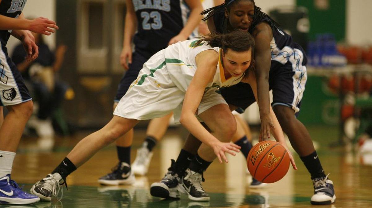 Hailey Turner, fighting for a loose ball against Central Valley while playing for Richland during the 2013-14 season, is now a junior at Lewis-Clark State College and on Thursday was named an NAIA All-American Honorable Mention.