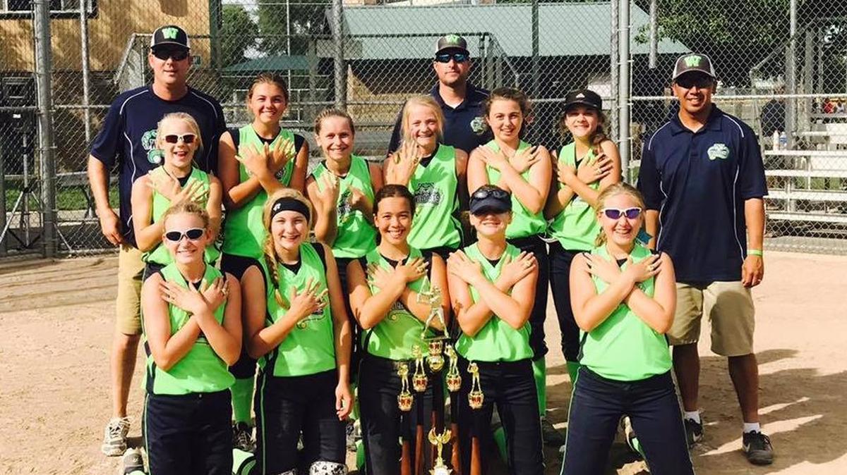 The Wildcats 04 celebrate their 12U B state softball title July 9 in Richland.