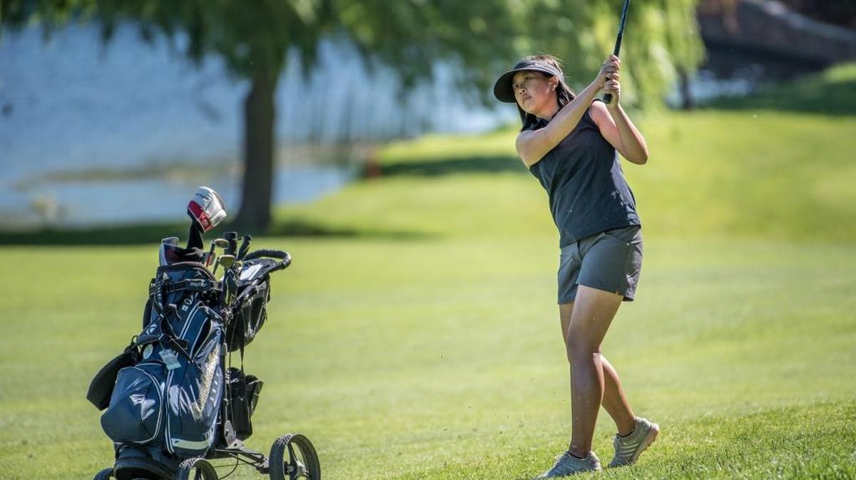 Samantha Hui of Southridge hits an approach shot on the first hole of the Girls’ 3A state finals at Canyon Lakes on Wednesday.