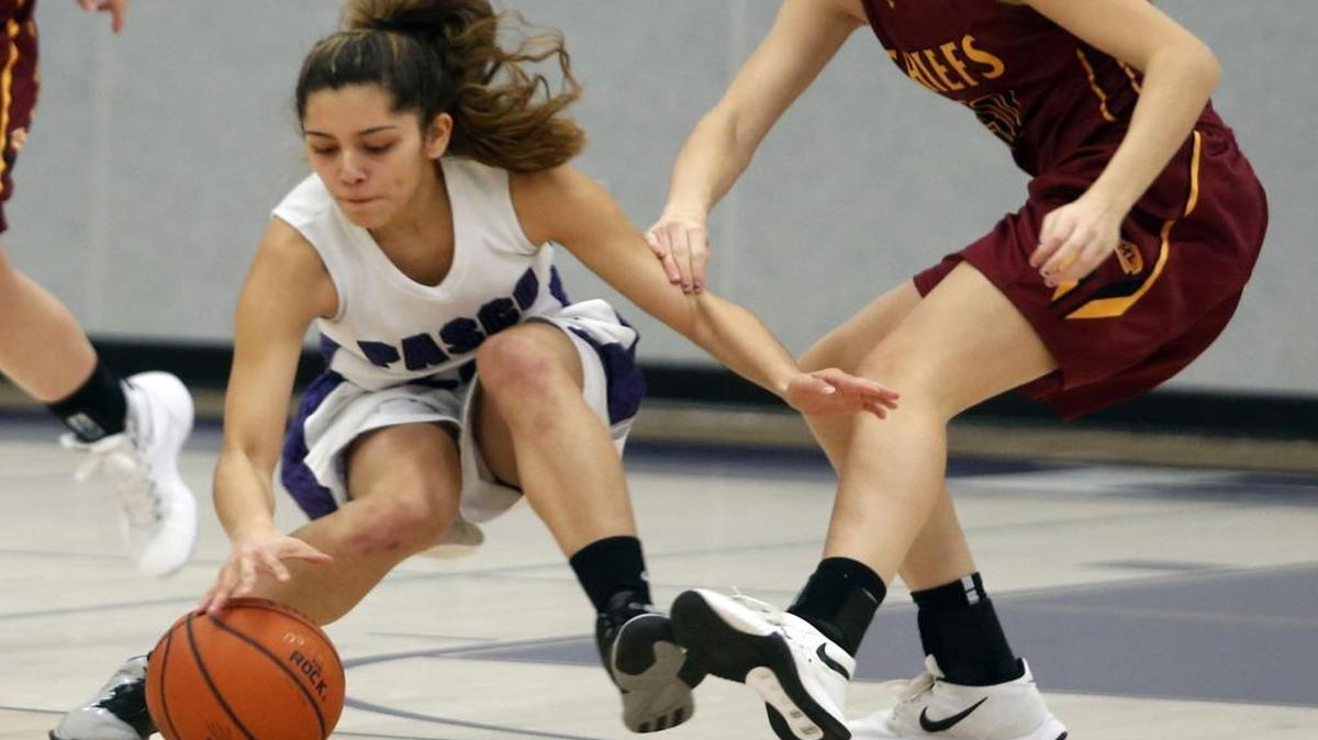 Julissa Perez, left, of host Pasco High School, steals the ball from Moses Lake’s Mikayla Chavez on Friday night.