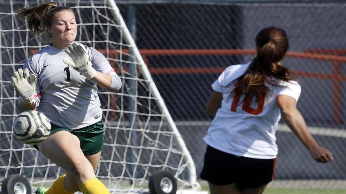 Richland goalkeeper Kiara Litka (1) stops a shot from Kennewick’s Klarissa Barajas Saturday during a game at Neil F. Lampson Stadium in Kennewick.