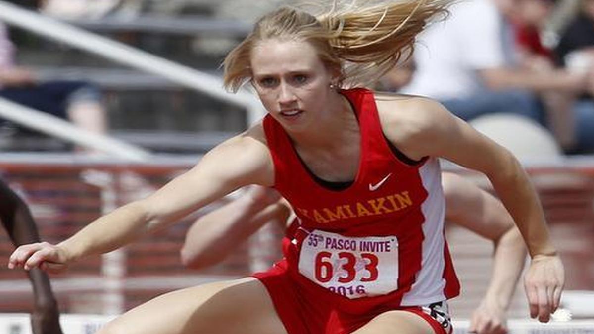 Kamiakin’s Heather Donias holds off Mead’s Zella Conley to win the girls 100-meter hurdles Saturday at the 55th annual Pasco Invitational at Edgar Brown Memorial Stadium. Donais also won the 300 hurdles.