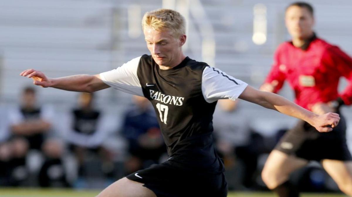 Hanford High’s Ross Kieffer (17) jumps over Southridge High School’s Emilio Sanchez (10) on Thursday during a boys soccer game at Neil F. Lampson Stadium in Kennewick.