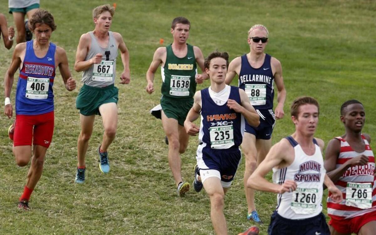 Richland’s Riley Moore (1638) and College Place’s Kenneth Rooks (235) compete Saturday in the Max Jensen Richland Invitational boys Division I race at Carmichael Middle School. Moore finished fourth in 15 minutes, 10.4 seconds, and Rooks was seventh in 15:20.92. Jackson’s Matthew Watkins (667) won in 14:52.51.