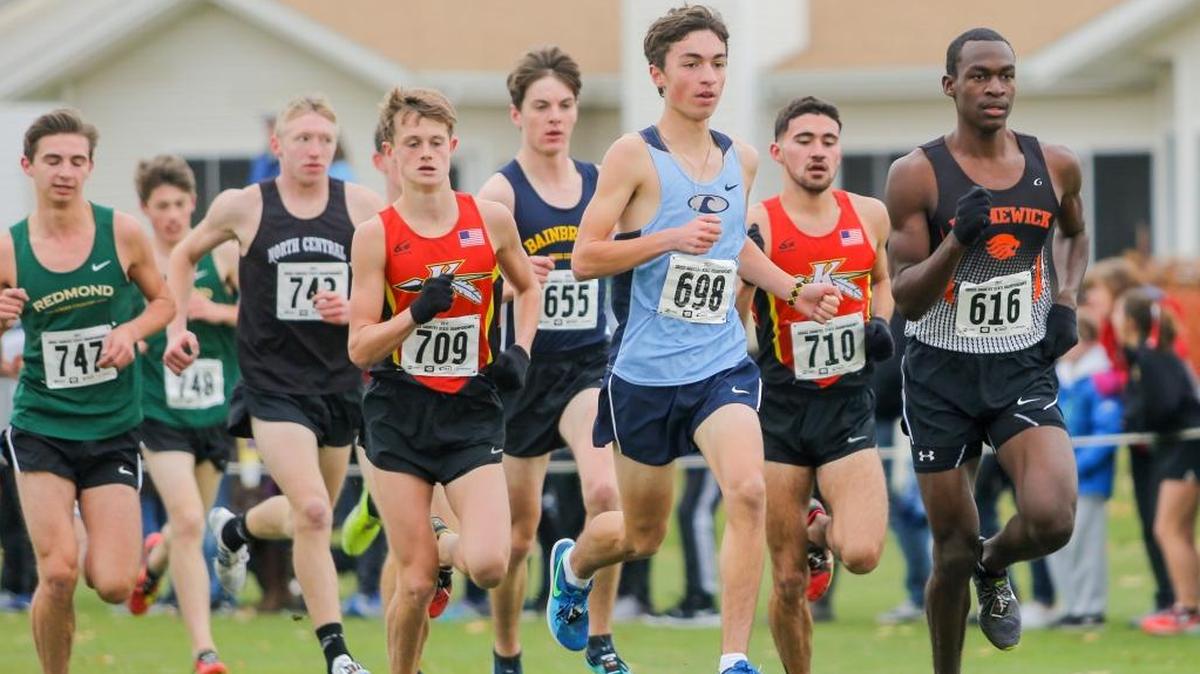 Kamiakin’s Ryan Child (709) and Jonah Franco (710) compete in the WIAA Class 3A State Cross Country Championship on Saturday at Sun Willows Golf Course in Pasco. Franco took fourth and Child fifth to lead the Braves to the team title.