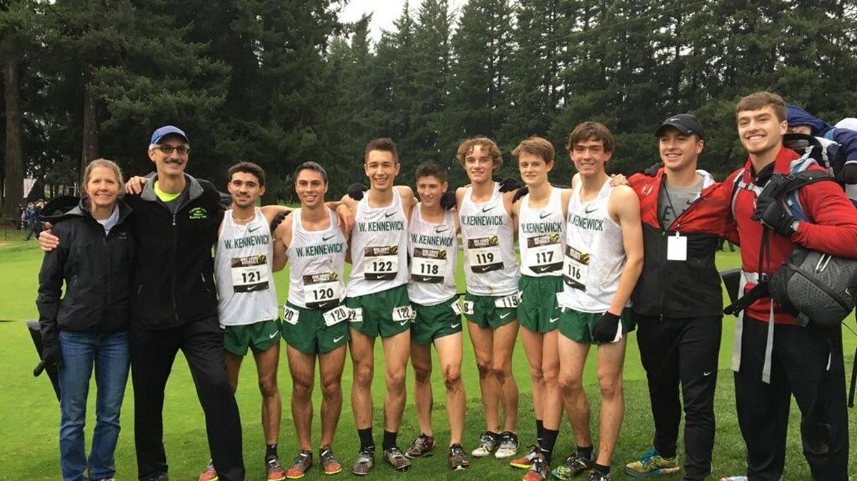 The Kamiakin boys cross country team finished 17th Saturday at the Nike Cross Nationals in Portland. Team members are (from left) coach Julene Brooks, coach Matt Rexus, Jonah Franco, Preston Glade, Peyton Hill, Porter Grigg, Stanford Smith, Ryan Child, Andrew Holladay, Kyle Paulson and Kevin Paulson.