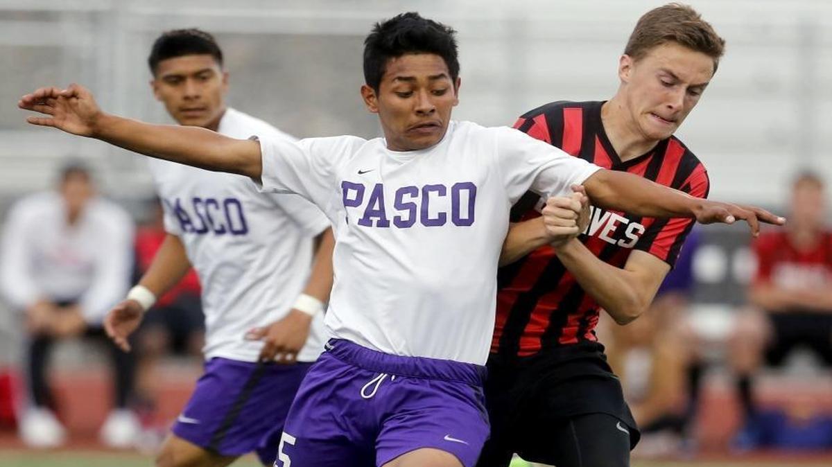 Pasco’s Jesus Meraz-Rodriguez (15) fights Kamiakin’s Brandon Weimar for the ball during Tuesday’s Mid-Columbia Conference soccer match at Edgar Brown Memorial Stadium. See more photos at www.tricityherald.com.