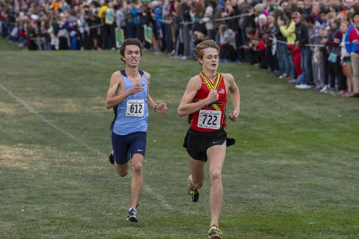 Gig Harbor’s Bradley Peloquin and Kamiakin’s Ryan Child competes in WIAA 3A boys cross country state championship at Sun Willows Golf Course in Pasco on Saturday. Child took third place with a time of 15:32.90 and Peloquin took fourth with a time of 15:33.30.