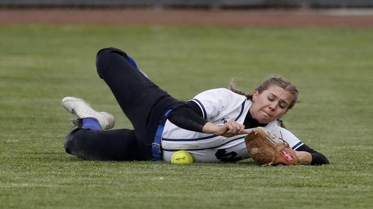 Walla Walla High School outfielder Tara Krivoshein traps the softball on a dive during the first game of Friday’s Mid-Columbia Conference doubleheader against host Chiawana.