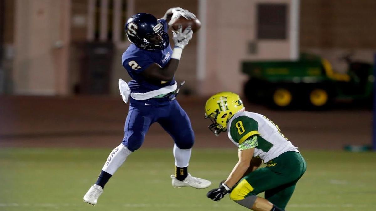 Southridge’s Sam Kori (2) pulls down a pass in front of Shadle Park defensive back Silas Say (8) during Tuesday’s playoff game at Lampson Stadium. The Suns led 37-20 in the fourth quarter. Results are posted at tricityherald.com/sports.