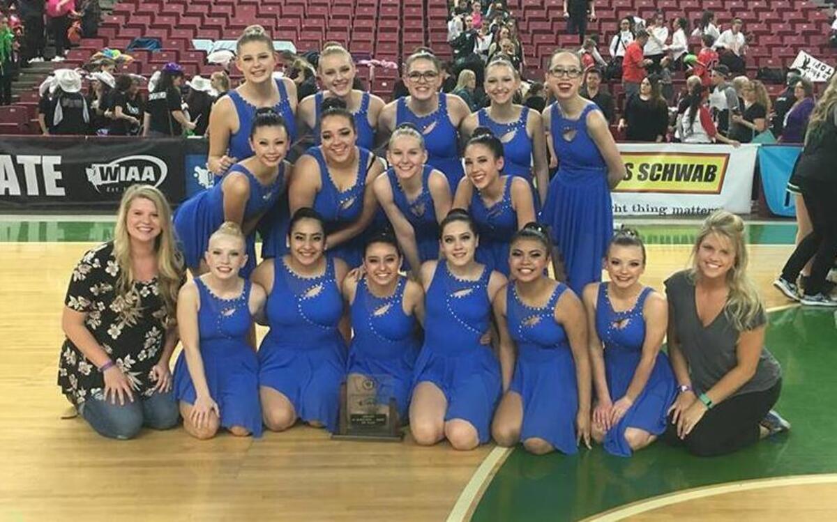 The Walla Walla High school dance team poses with its fourth-place trophy at the state dance competition Friday at the Yakima Valley SunDome.