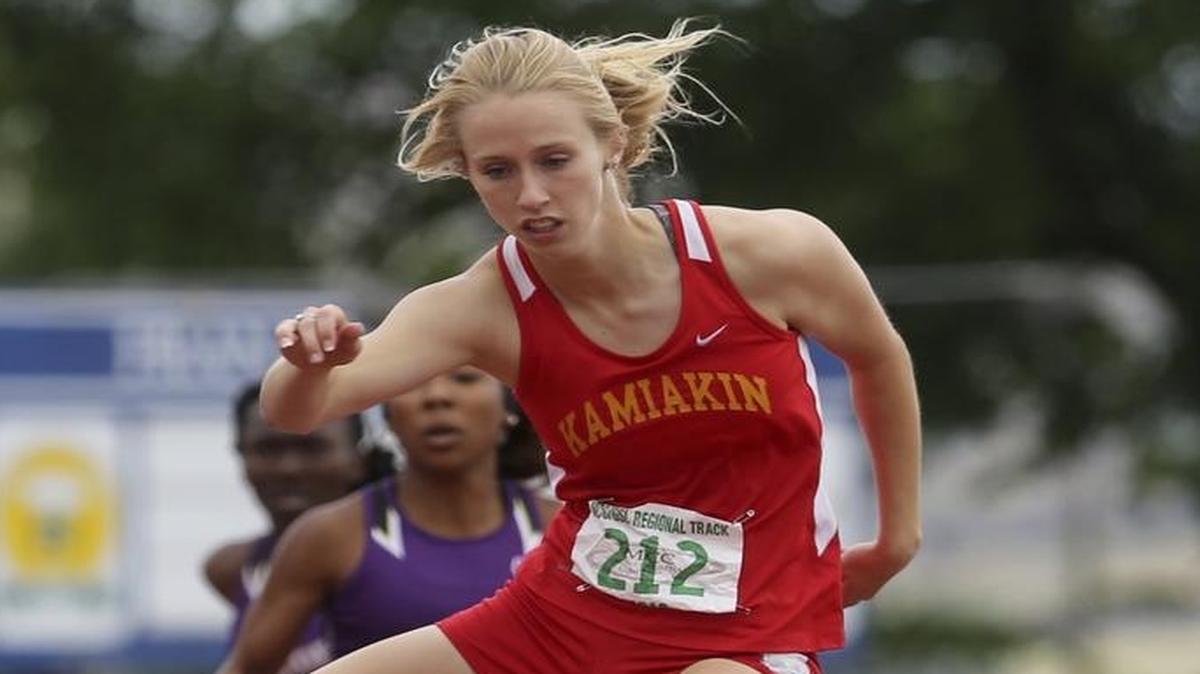 Kamiakin’s Heather Donais is well out in front in the girls 300-meter hurdles during Saturday’s regional track and field championships. See more photos at tri-cityherald.com/galleries.