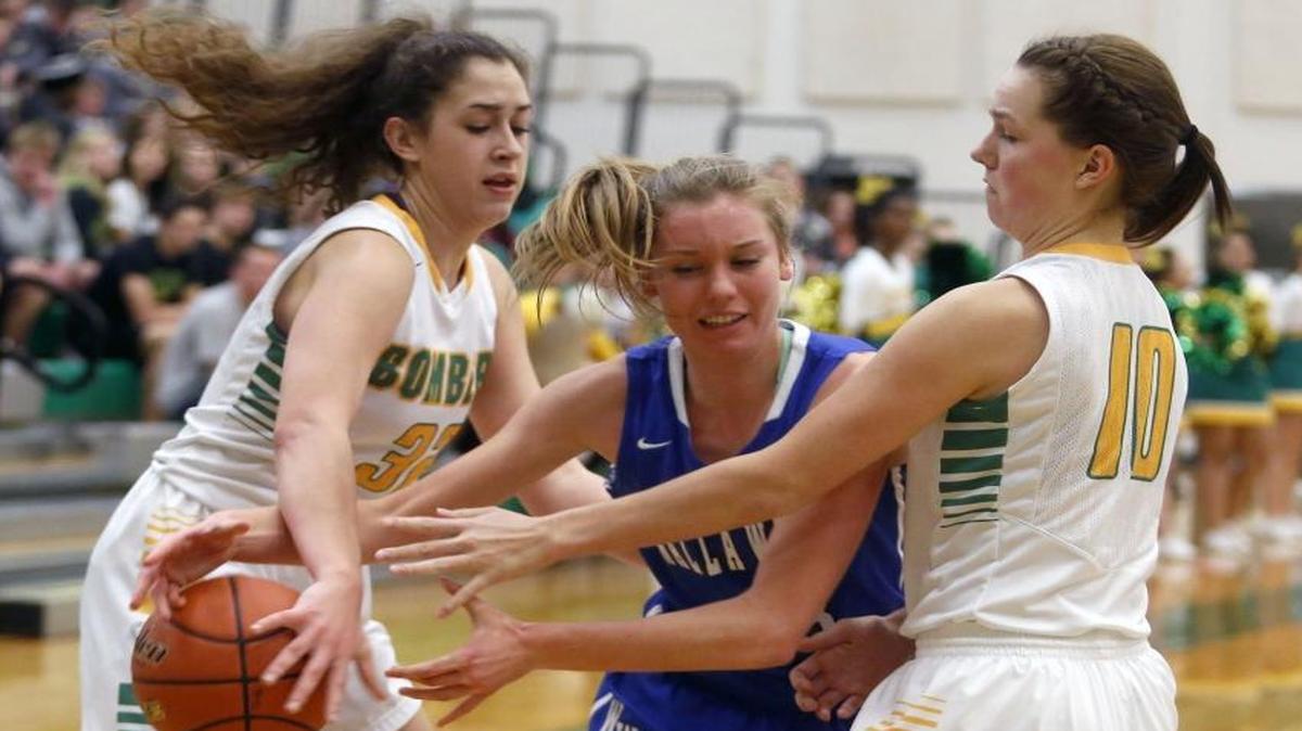 Richland’s Gia Sorn (32) and Mickala Trappett (10) double team Walla Walla’s Emma Wenzel during Saturday’s Mid-Columbia Conference game at Richland.