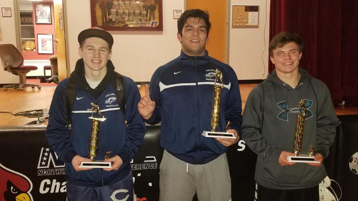 Chiawana senior Josh Alvarez (center) poses with his trophy after winning the 285-pound title at the Tri-State wrestling tournament at North Idaho Community College in Coeur d’Alene. Teammates Tyson Stover (160 pounds, left) and Riley Cissne (145, right) were runners-up in their respective weight classes at the tournament.