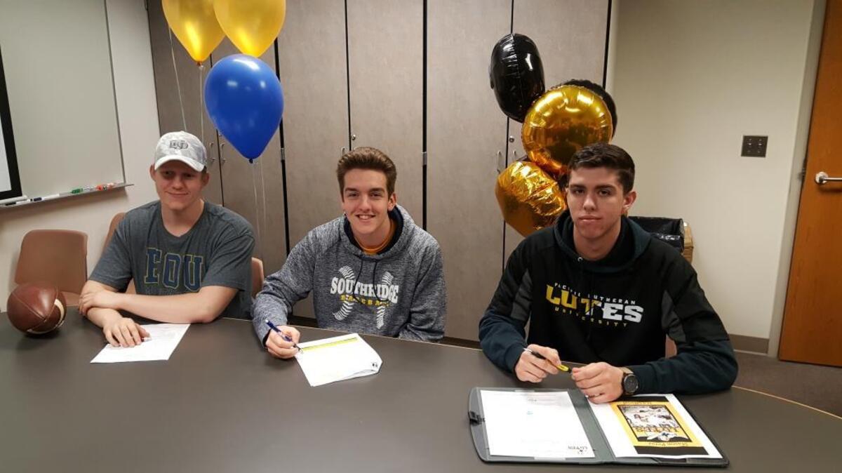 Southridge High School athletes Flynn McPheron, from left, Sergio Midili and Mason Perez signed their letters of intent Wednesday to play college sports.
