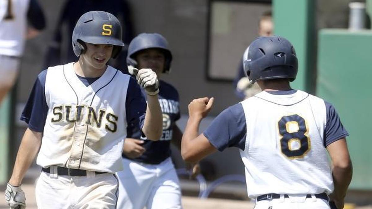 Southridge’s Bryce Grigg, left, congratulates Calee Beal for scoring a run in Saturday’s third-place game at the Class 3A baseball championships at Gesa Stadium. Southridge beat Sumner 11-0 for its best finish in a dozen years.