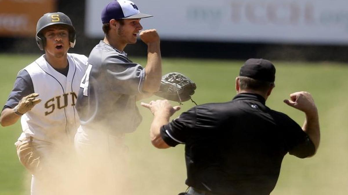 Southridge’s Jashaun Simon, left, and Lake Washington shortstop Austin Lively react to an umpire’s call in the ninth inning of Friday’s Class 3A baseball state semifinal game at Gesa Stadium in Pasco. Lake Washington won the game 5-4. Southridge will play for third place at 10 a.m. Saturday.
