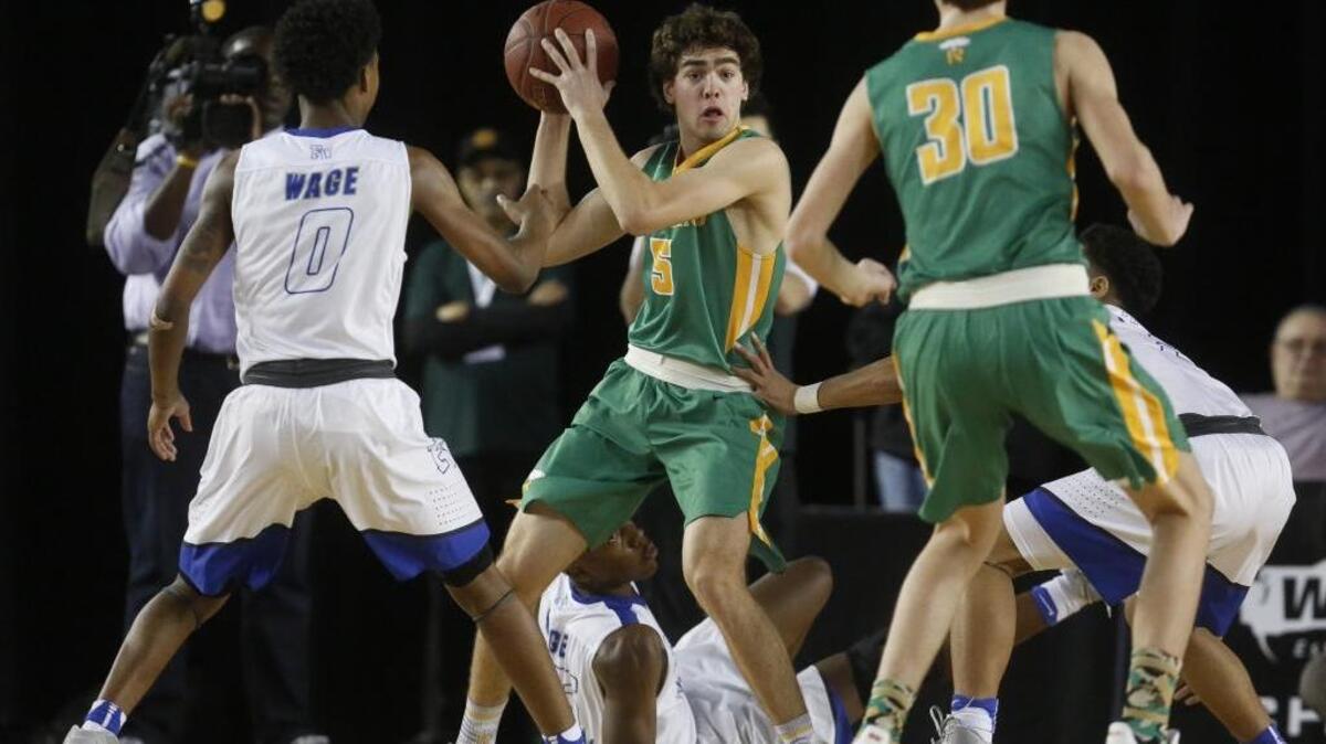 Richland's Sammy King (5) looks to pass in the third quarter. Federal Way played Richland in a basketball game at the Tacoma Dome in Tacoma on Thursday.
