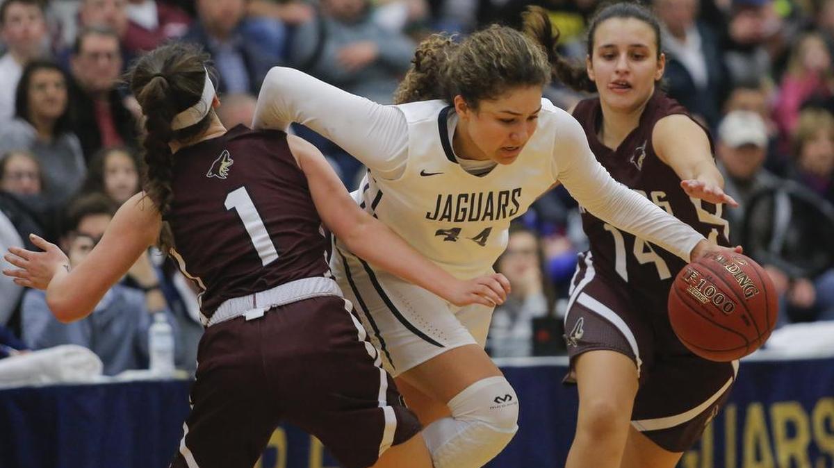 Tri-Cities Prep’s Talia von Oelhoffen (44) splits the double team of Kittitas/Thorp’s Amelia Mohn (1) and Aina Martinez (14) during an EWAC girls basketball game Friday at Tri-Cities Prep in Pasco. Despite relentless defensive pressure, the freshman von Oelhoffen scored a game-high 24 points to help the Jaguars to a 59-40 victory.