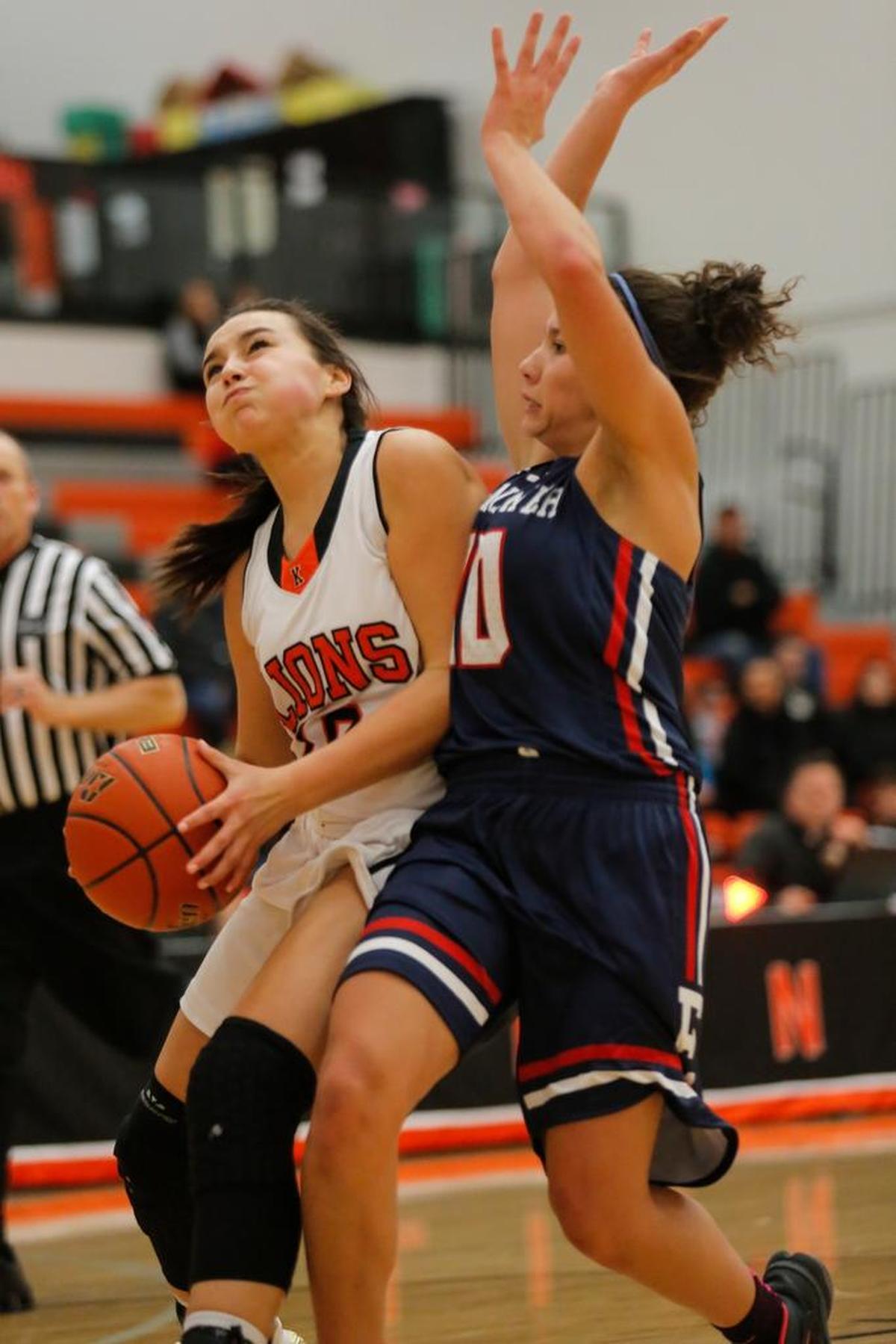 Kennewick's Aislin Fiander (10) takes a shot while being guarded by Eisenhower's Bobbie Rideout during a girls basketball game at Kennewick High School on Friday.