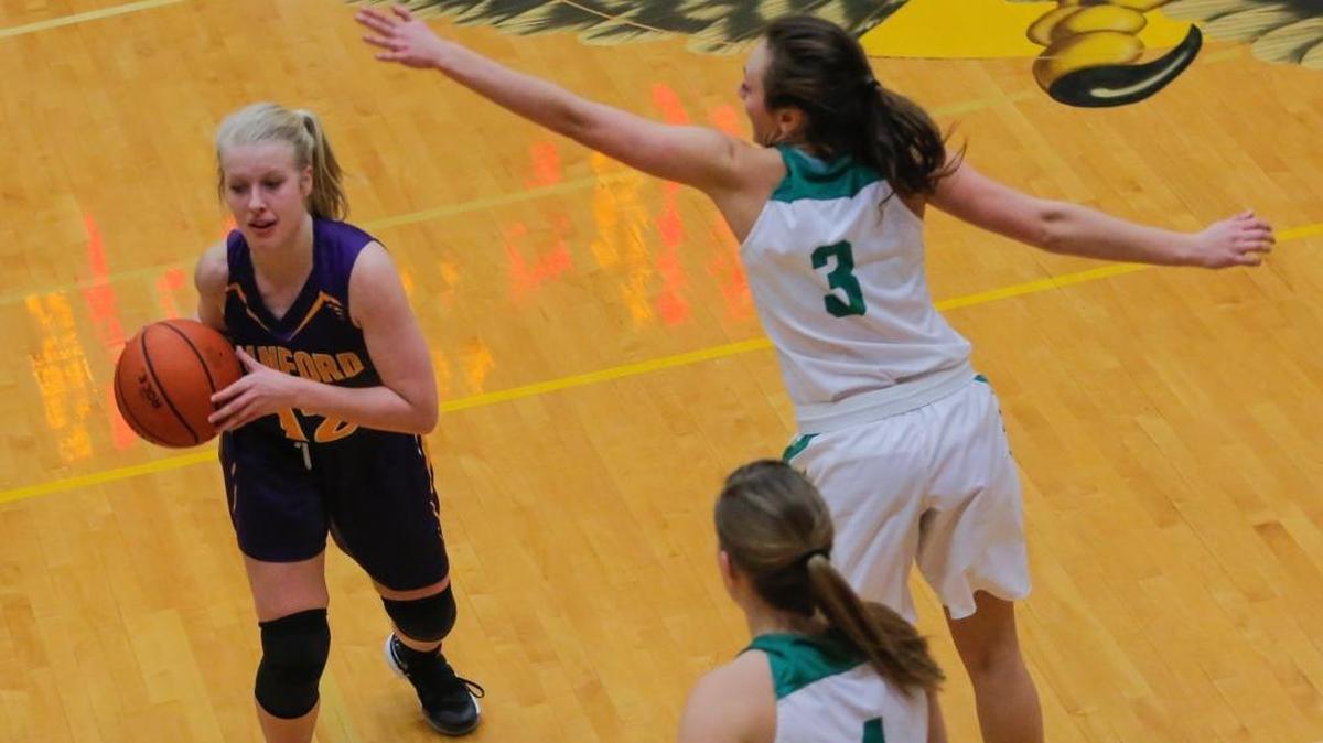 Hanford's Emily Beattie (12) looks pass while being guarded by Shadle Park's Emilie Tangeman (4) and Makenna Grier (3) Thursday during the Hanford Holiday Tournament. Hanford won in double overtime 40-37.
