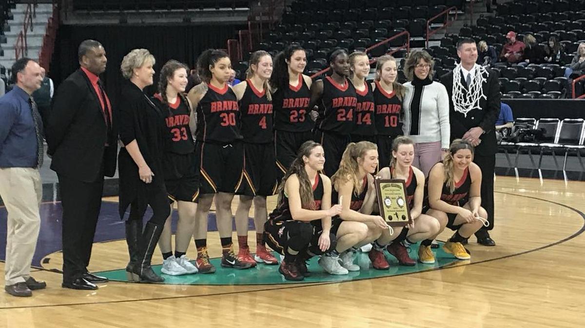 The Kamiakin Braves girls basketball team poses for a photo after beating the Mt. Spokane Wildcats 59-51 in the District 8 3A championship on Thursday at the Spokane Arena.