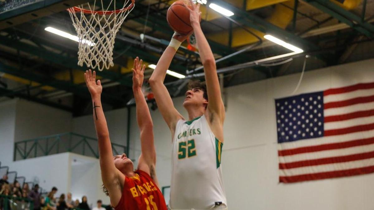 Kamiakin's Payton Flynn (15) tries to guard Richland's Riley Sorn (52) as he takes a shot during a Mid-Columbia Conference high school basketball game on Tuesday at Richland High School. The Bombers won 69-48