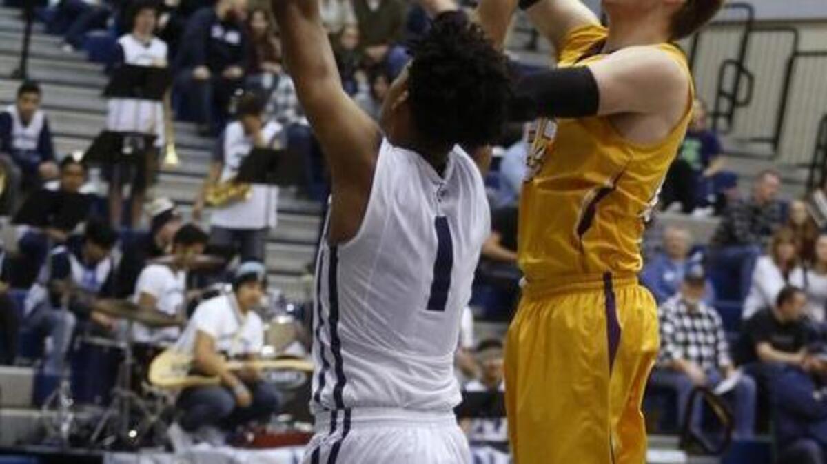 Hanford’s Jacob Sivonen (22) puts up a shot over Chiawana’s Jalen King (1) on Saturday during a boys basketball game at Chiawana High School. See more photos at www.tricityherald.com