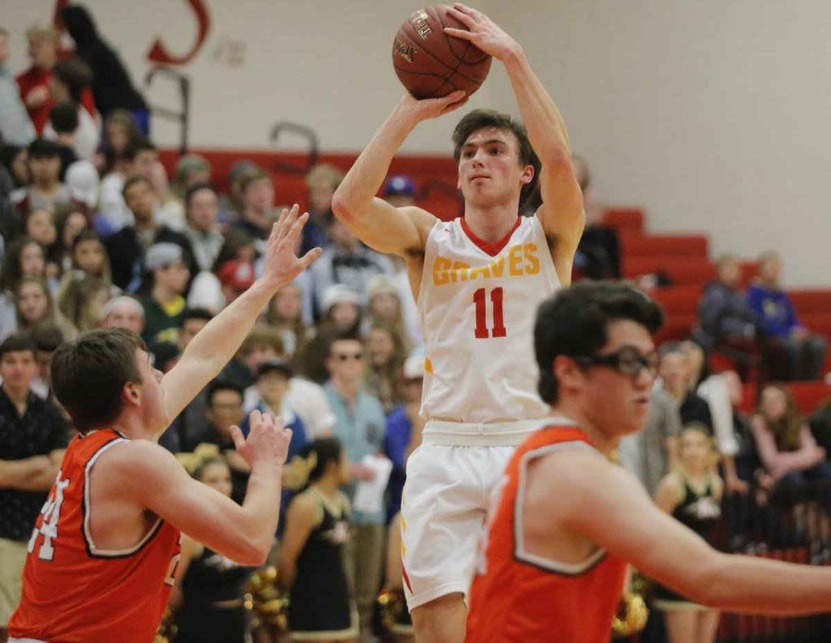 Garrett Paxton (11), takes a jump shot.