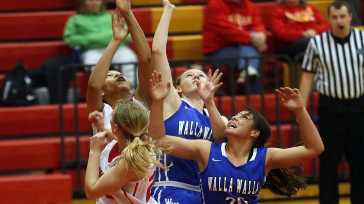 From let, Kamiakin’s Alexa Hazel, Symone Brown and Walla Walla’s Kyndal Locati and Faith Hoe battle for a rebound during Tuesday’s Mid-Columbia Conference game at Kamiakin. Walla Walla won in overtime 62-61.