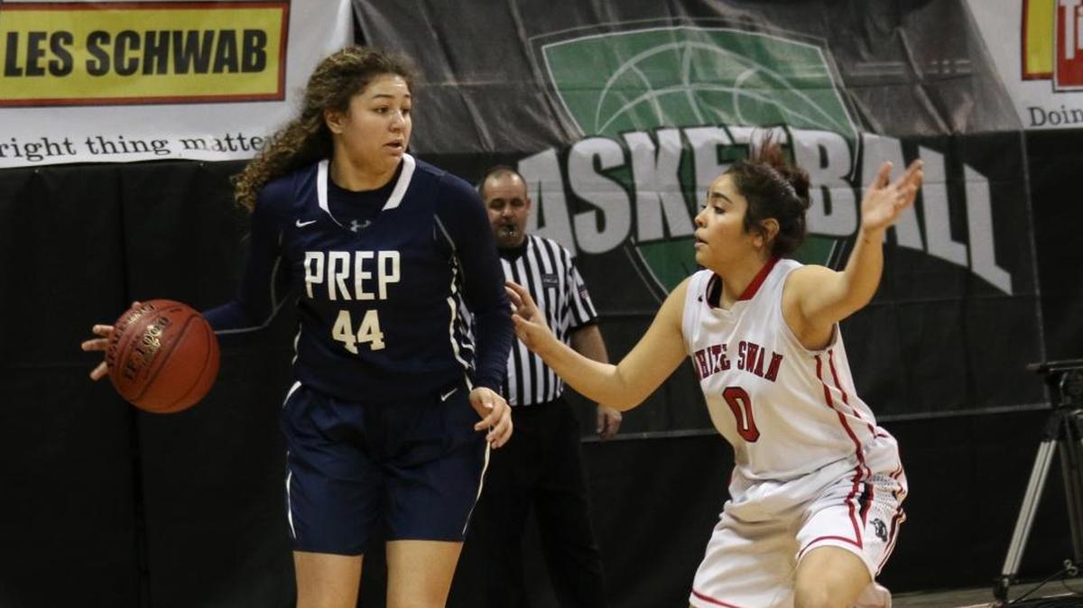 White Swan’s Gladys Pineda (right) guards Tri-Cities Prep’s Talia von Oelhoffen during their 2B state tournament game Wednesday at Spokane Arena. Von Oelhoffen had 24 points as TCP beat White Swan 77-63 to advance to the quarterfinals.
