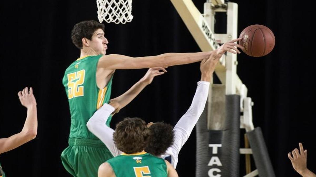 Richland’s Riley Sorn, middle, goes to block the shot of a Gonzaga Prep player during Saturday’s game at the 4A boys state tournament in Tacoma. Richland lost 64-57 place fifth.