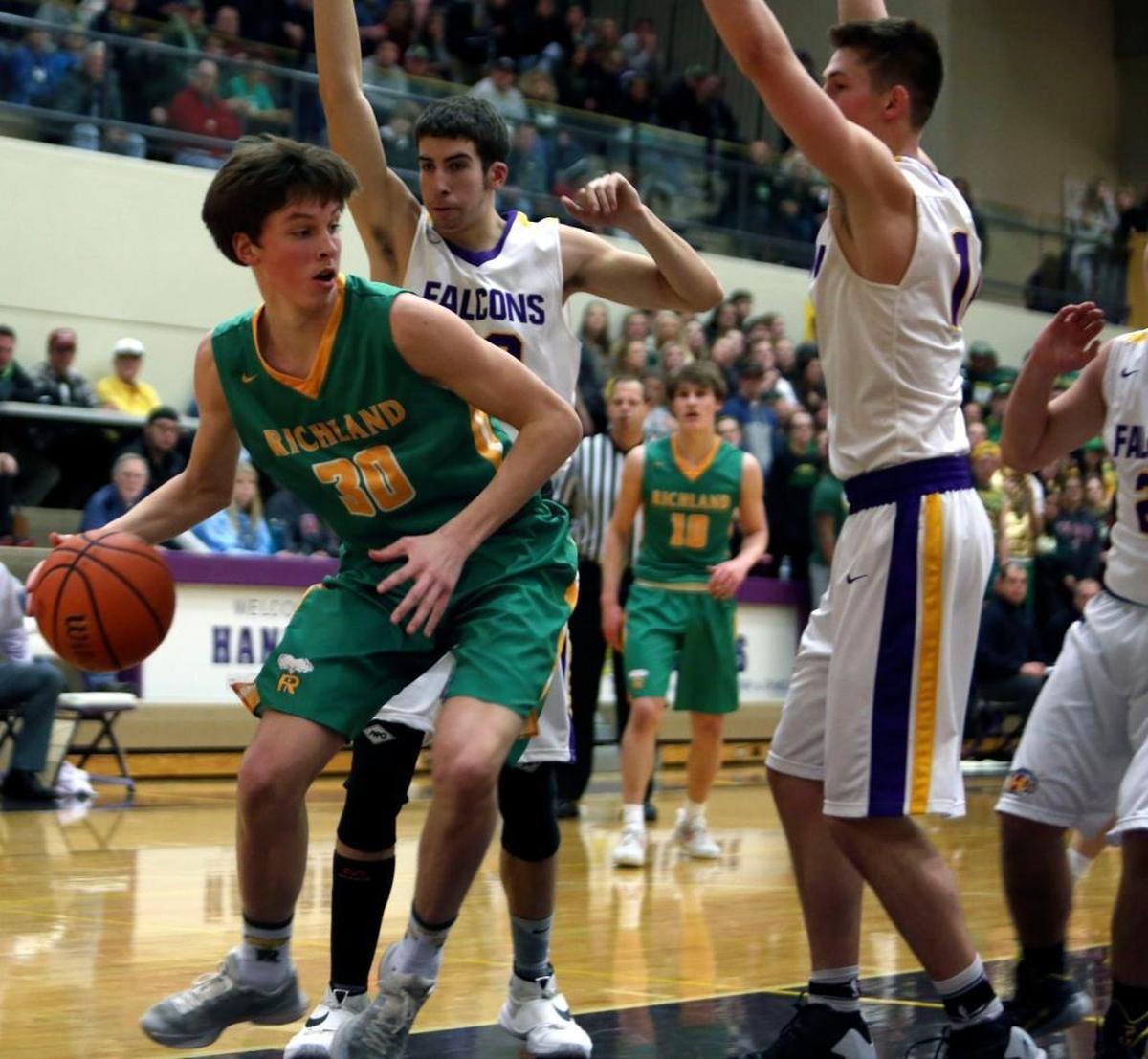 Richland’s Garrett Streufert, driving against the Hanford Falcons during the 2016-17 season, is a 6-foot-6 junior starting guard for the 22-0 Bombers. His dad, Earl, is the team’s coach, and he grew up rooting for his older brother Nathan, who was the 2014 WIBCA All-State Player of the Year and is now a redshirt junior for Seattle Pacific.