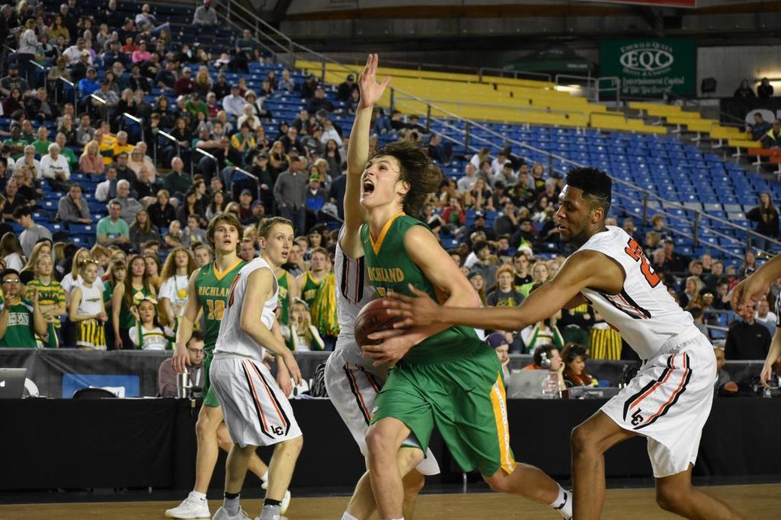 Richland’s Cole Northrop drives past Lewis and Clark’s Naje Smith, right, during the third-/fifth-place game of the WIAA 4A state tournament. Northrop finished with 20 points, but the Bombers fell 76-70.