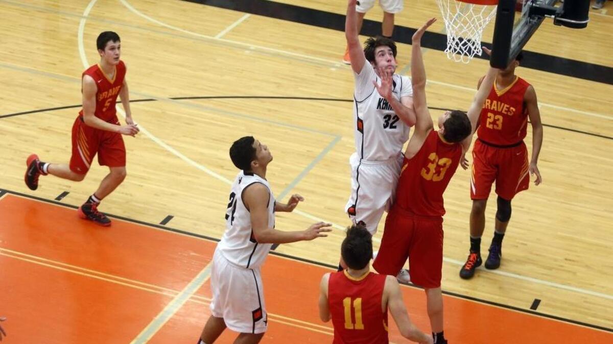 Kamiakin’s Hayden Nelson (33) stands firm on defense against Kennewick’s Samuel Szendre (32) during Saturday’s MCC/GSL subregional game at Kennewick.