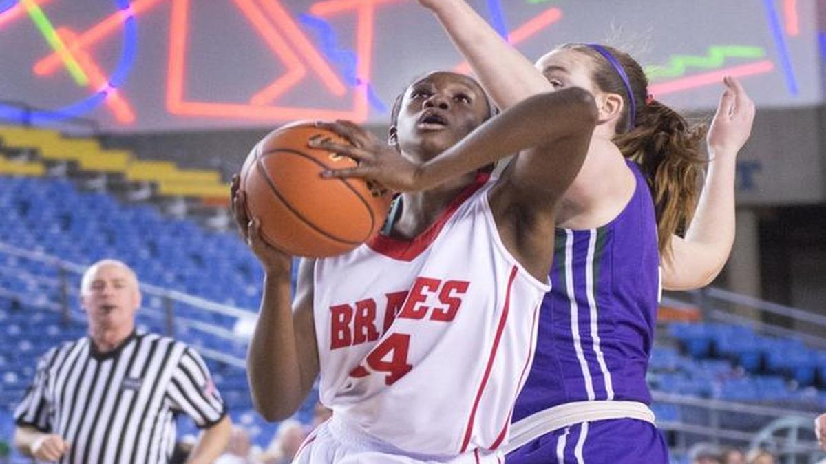 Kamiakin’s Oumou Toure, left, puts up a shot against Ingrid Fosberg of Edmonds-Woodway during the 2016 Class 3A state tournament in Tacoma.