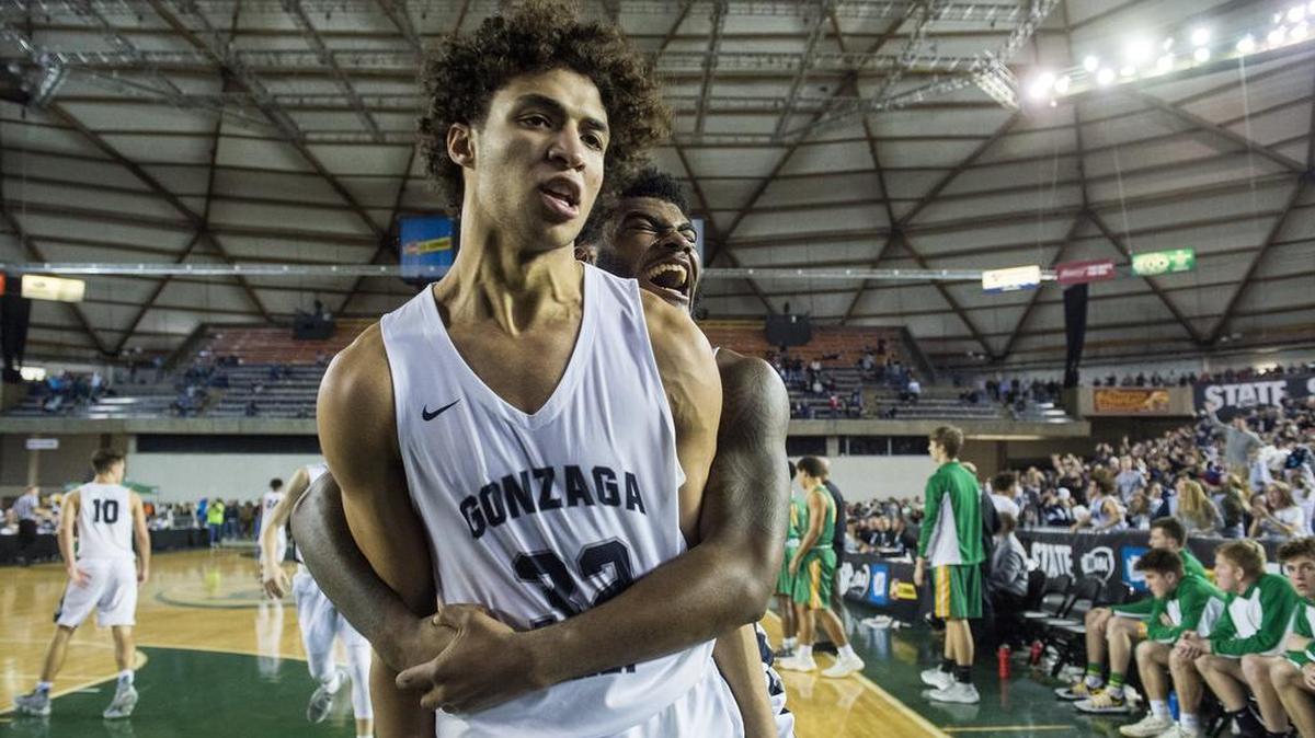 Gonzaga Prep’s Anton Watson (32) and Devin Culp (20) celebrate Watson’s game-winning three point shot. Richland played Gonzaga Prep in a semifinal bracket game at the Hardwood Classic state basketball tournament at the Tacoma Dome in Tacoma, Wash., on Friday, March 2, 2018.