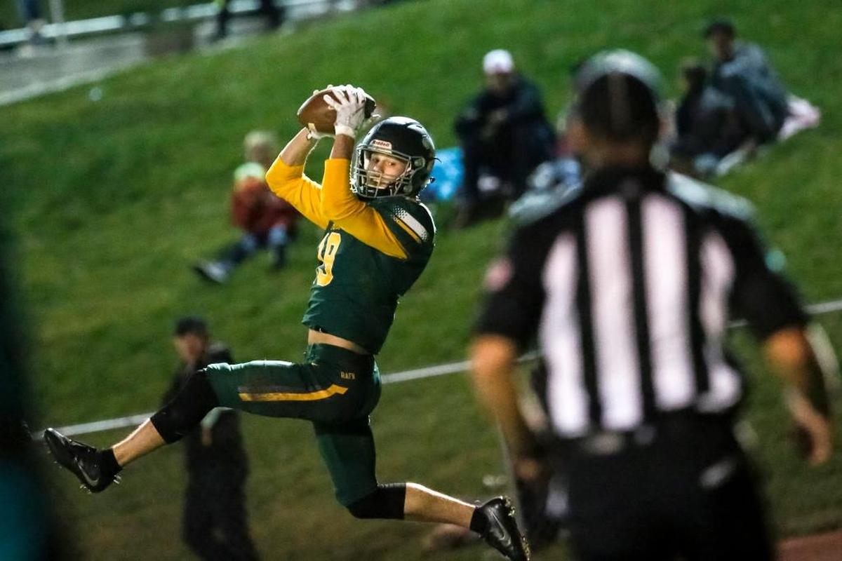 Richland's Cody Sanderson (19), jumping to catch a touchdown pass during a 2017 MCC football game against Kamiakin, is not only a member of the Bombers’ state championship winning football team, he also starts on their basketball team that will be seeking a title at next week’s state tournament in Tacoma
